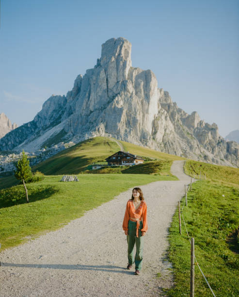 istock Woman walking in Dolomites mountain during summer vacation 1789722741