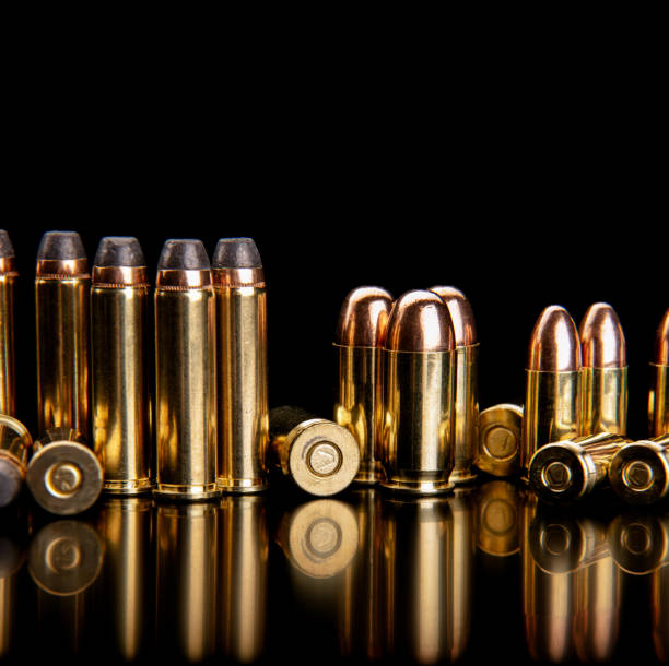 istock Bullet isolated on black background with reflexion. Rifle bullets close-up on black back. Cartridges for rifle and carbine on a black. 1789723835