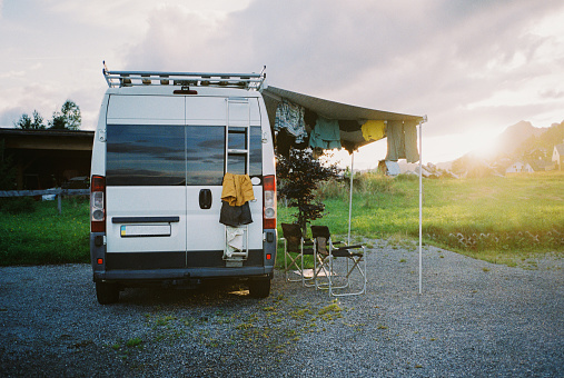 Drying laundry on camper van at campsite. Shot on camera film