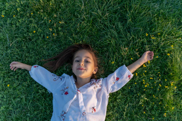 istock A girl lying on the lawn. 1789737167