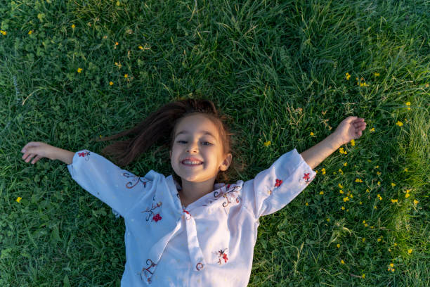istock A girl lying on the lawn. 1789737905