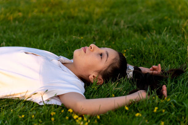 istock A girl lying on the lawn. 1789743420