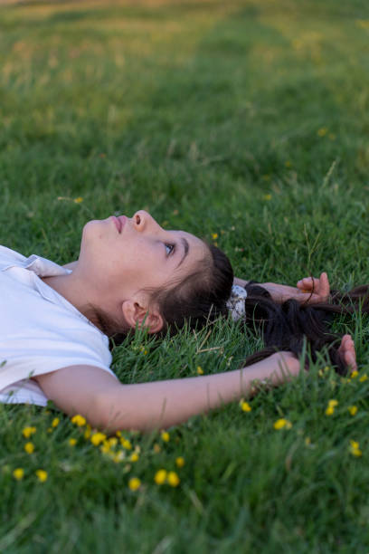 istock A girl lying on the lawn. 1789743939
