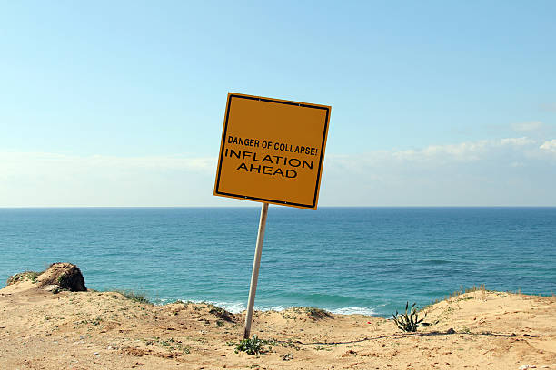 istock DANGER OF  COLLAPSE and Inflation ahead sign 178974428