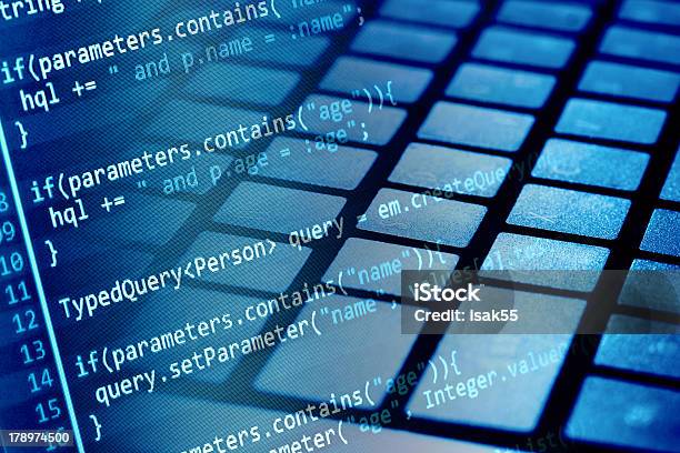Program Code And Computer Keyboard Stock Photo - Download Image Now - Abstract, Backgrounds, Blue