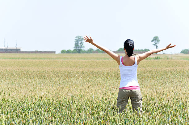 woman happy wheat field
