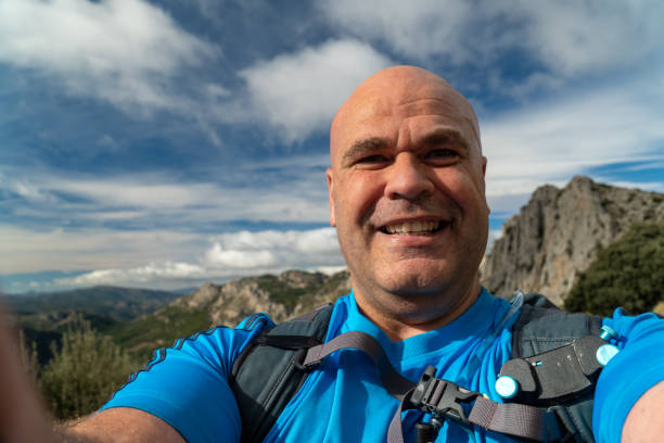 istock Happy hiker takes a selfie in the mountain 1789751265