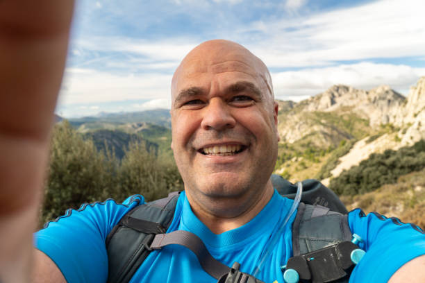 istock Happy hiker takes a selfie in the mountain 1789751267