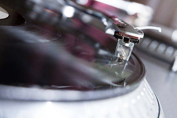 istock Turntable playing vinyl record with music 178975805