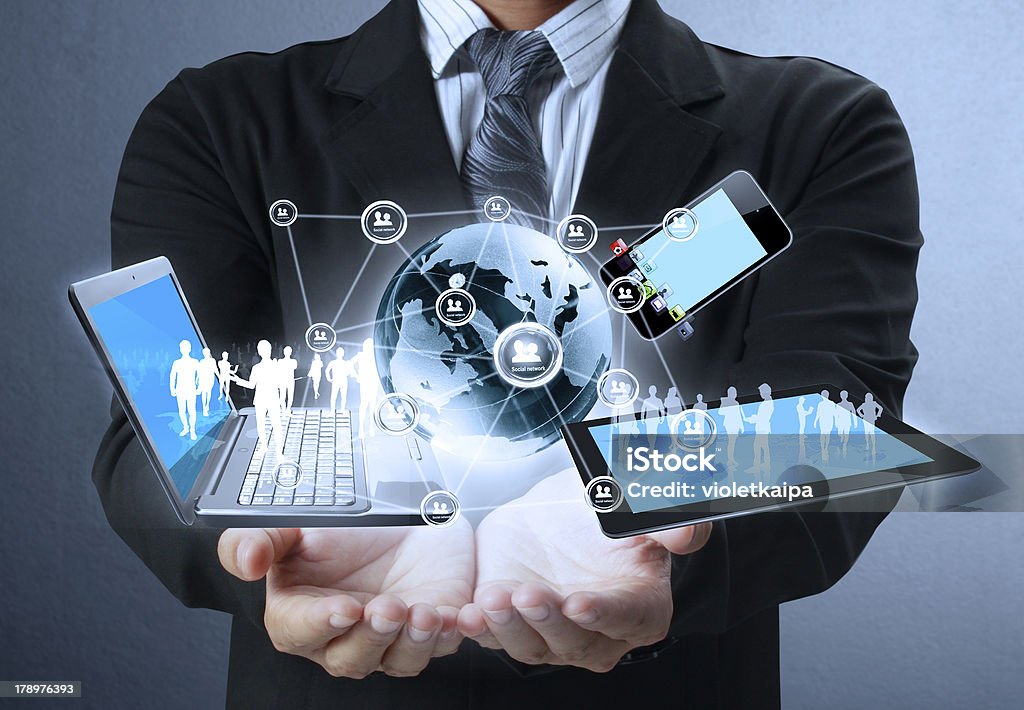 Businessman holds modern technology in hands Technology in the hands of businessmen Work Tool Stock Photo