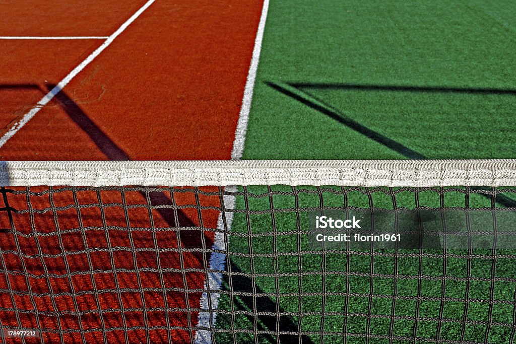 Synthetic sports field for tennis "Sports field with synthetic turf, markings and netting used in tennis.Detail." Artificial Stock Photo