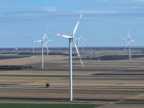 Across the vast landscapes, wind turbines serve as connectors to a more sustainable future.