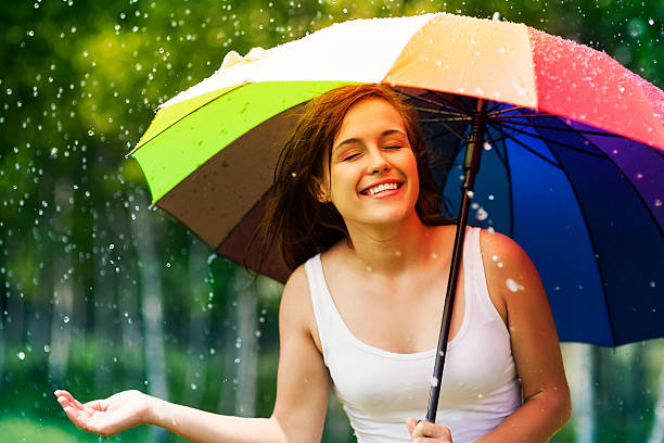 istock Beautiful woman enjoying summer rain 178978573