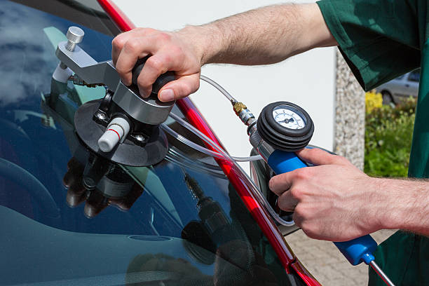 istock Glazier repairing windscreen after stone chipping damage 178979222