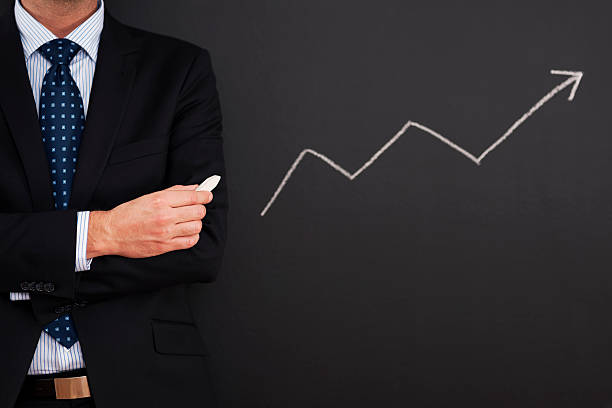 istock Businessman standing close to arrow sign 178980309