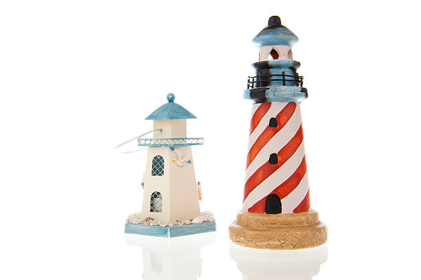 istock Two lighthouses close-up isolated in white 178980381