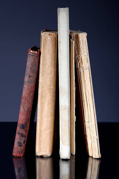 istock Pile of old books on grey background 178980635