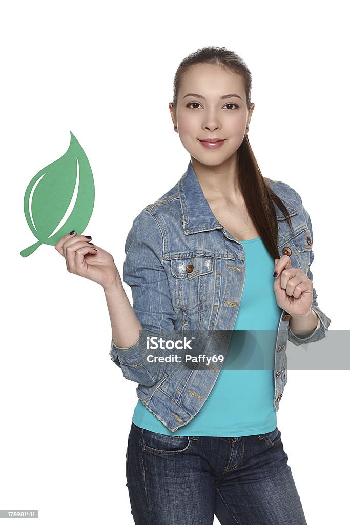 Donna con foglia verde simbolo - Foto stock royalty-free di Abbigliamento casual