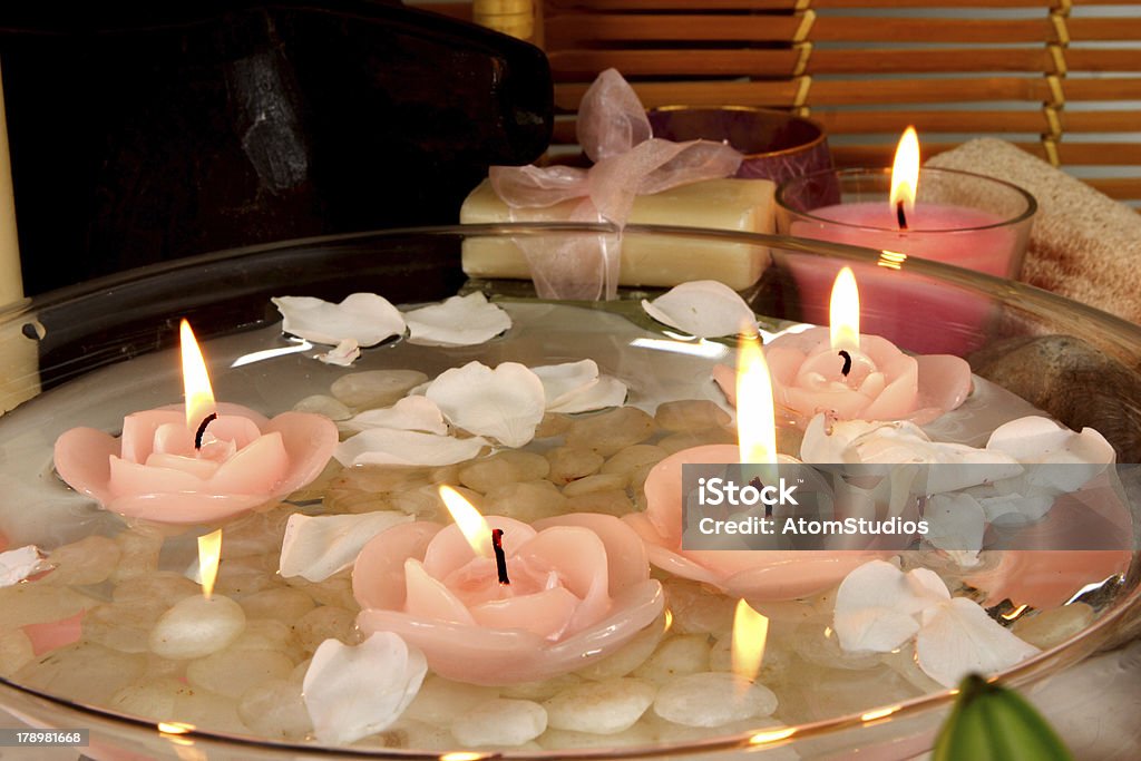 floating candles tranquil floating candles and rose petals Floating Candle Stock Photo