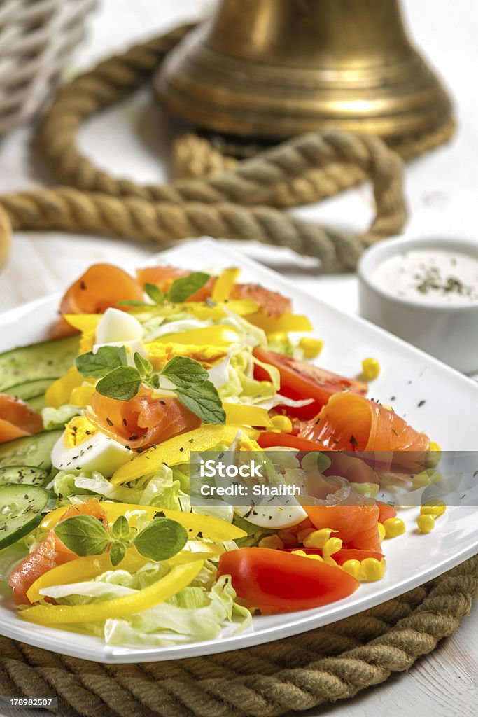 Closeup of healthy salad with salmon and vegetables Closeup of healthy salad with salmon and vegetables. Appetizer Stock Photo