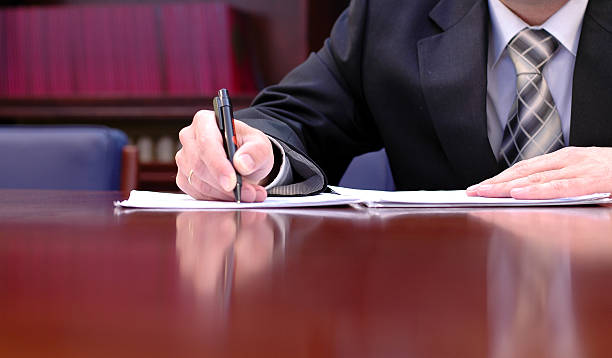 istock businessman is signing a contract 178982657