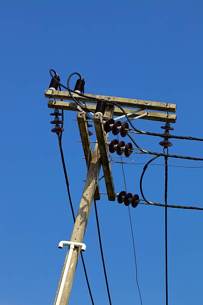 Electricity pole with wire under clearing blue sky stock photo