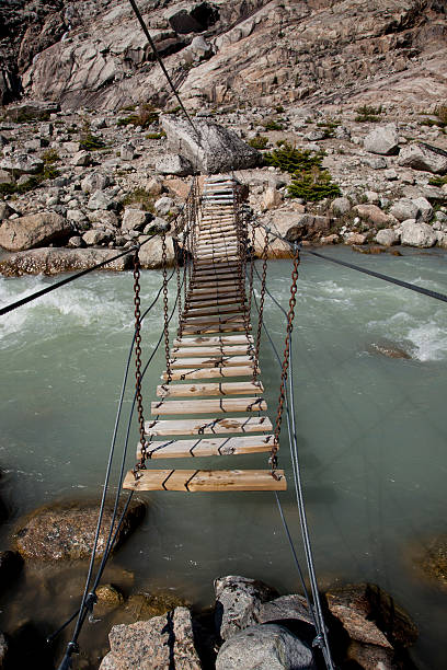 istock Wooden Trail Bridge over a Stream 178983638