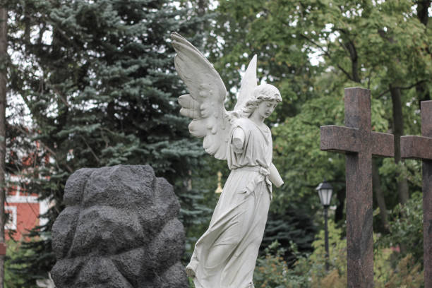 Sad antique statue in a cemetery