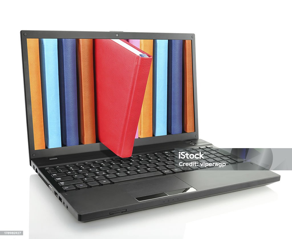 Laptop computer with colored books Book Stock Photo