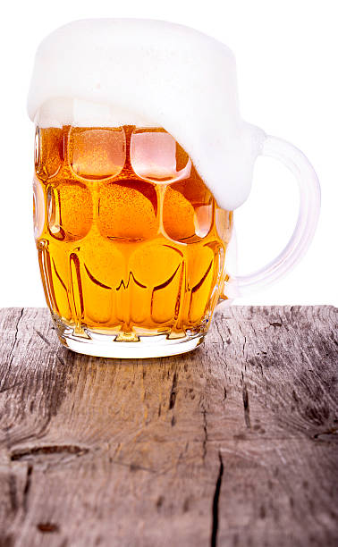 Beer glass on wooden table background Beer glass on old wooden table background isolated unbolted stock pictures, royalty-free photos & images