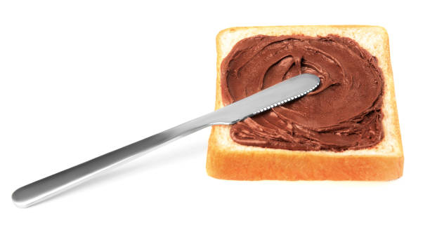 istock Tasty toast with chocolate paste and knife on white background 1789873053