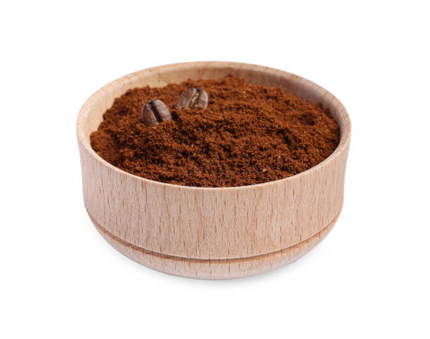 istock Bowl of ground coffee and beans on white background 1789873065