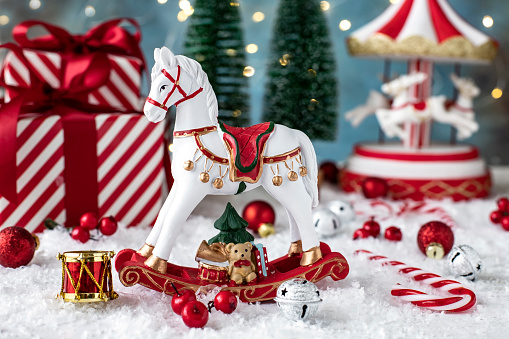 Christmas concept background.  Christmas composition  with horse toy on festive background