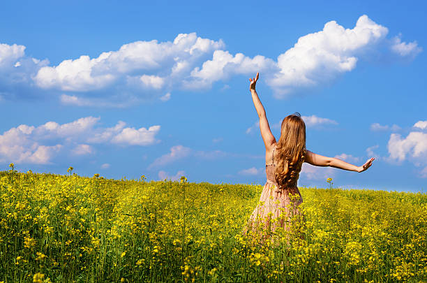 istock Young woman at canola field 178987620