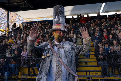 Ibi, Spain - December 28, 2022: Portrait of the character playing the mayor covered in flour after the traditional comic battle with the audience on his back in Ibi, Spain