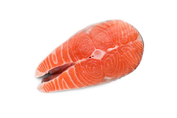 istock Fresh raw salmon steak isolated on white, top view 1789886975
