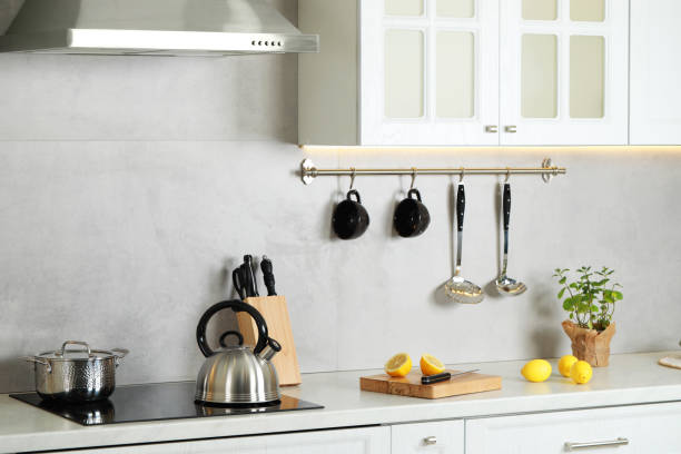 istock Stylish kettle with whistle on cooktop in kitchen 1789888048