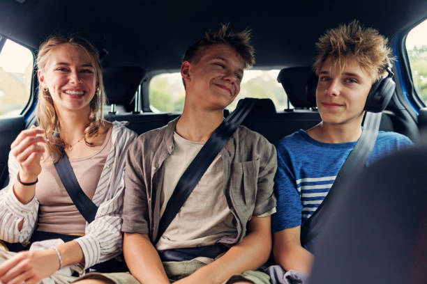 Three teenager kids travelling by car in United Kingdom Three teenager kids travelling by car in Cotswold, United Kingdom.
Shot with Canon R5 teenager boy driving stock pictures, royalty-free photos & images