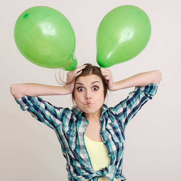 istock young woman with balloons 178989042