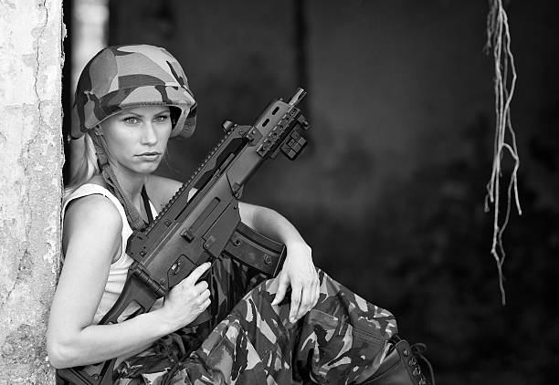 istock army girl with rifle 178989984
