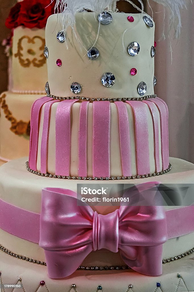 Wedding cake specially decorated.Detail Wedding cake specially decorated with crystals, pink ribbons and knot. Anniversary Stock Photo
