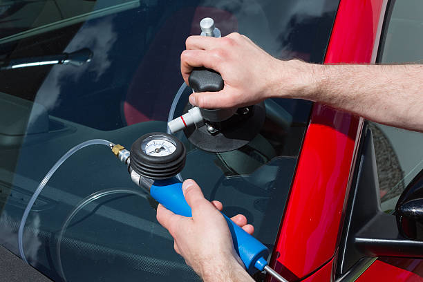 istock Glazier repairing windscreen after stone chipping damage 178990197