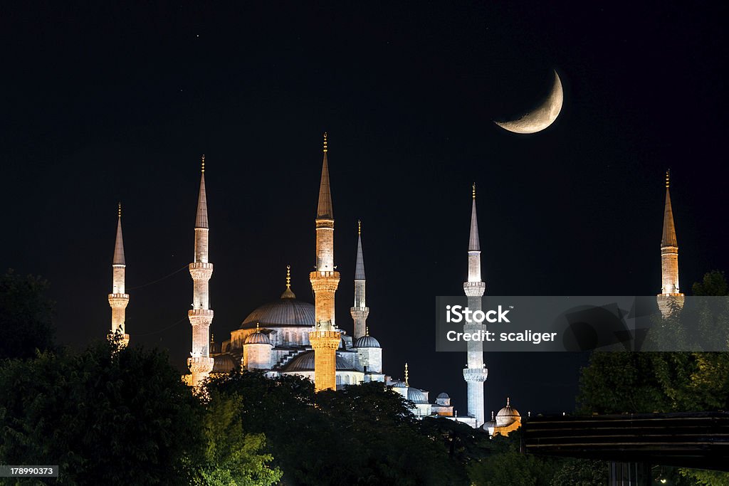 View of the Blue Mosque at night in Istanbul View of the Blue Mosque (Sultanahmet Camii) at night with Crescent, Istanbul, Turkey Ancient Stock Photo