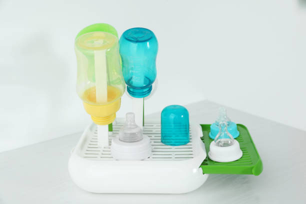 istock Dryer with baby bottles and nipples after sterilization on white table 1789903999