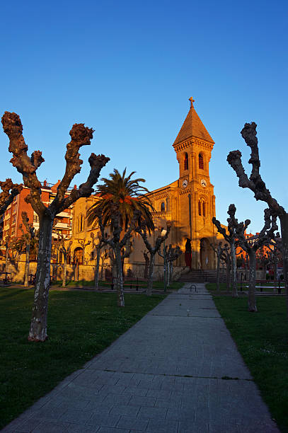 Church in Algorta, Getxo, at sunset with golden light