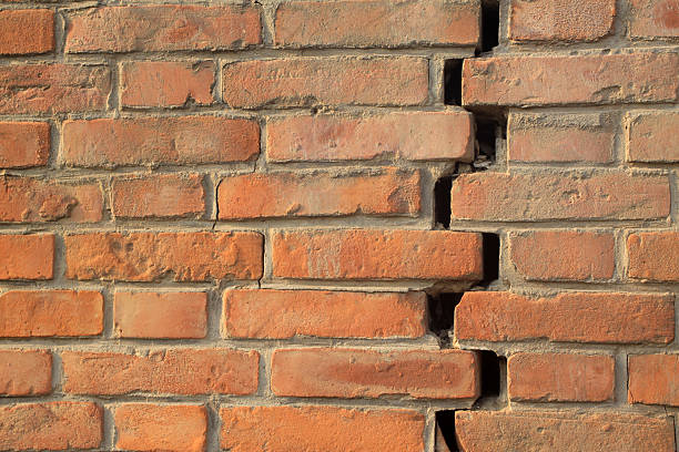 istock crack of red brick wall 178991187