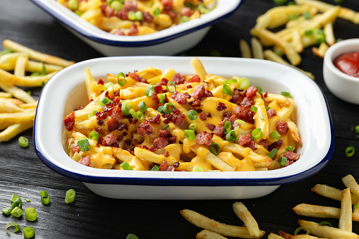Crispy French fries loaded with bacon, cheese sauce and spring onion.