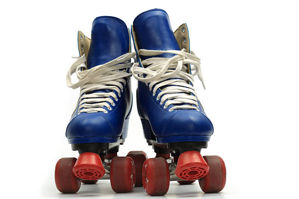 Vintage blue and red roller skates on a white background stock photo