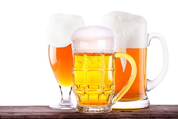 Beer glass on wooden table background Beer glass on old wooden table background isolated unbolted stock pictures, royalty-free photos & images