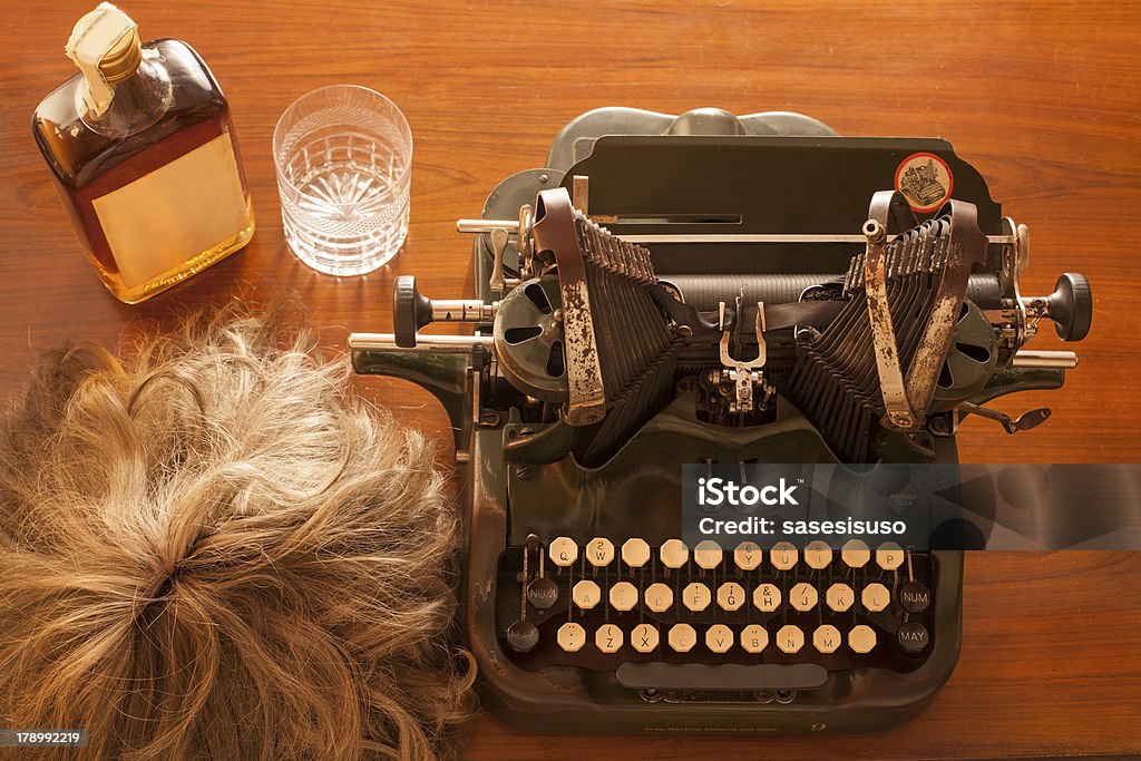 Writer scene "Detective or writer scene with wig, typewriter and wiskey" Crystal Glassware Stock Photo